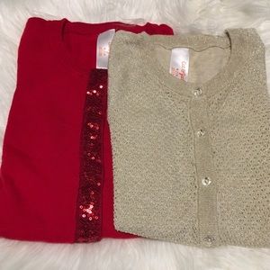 A pair of girls sweaters